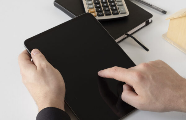 close-up-hands-holding-tablet-scaled