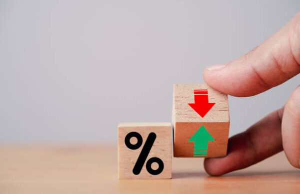istockphoto-1414982888-612x612 Hand flipping wooden cube block to change between up and down with percentage sign symbol for increase and decrease financial interest rate and business investment growth from dividend concept.